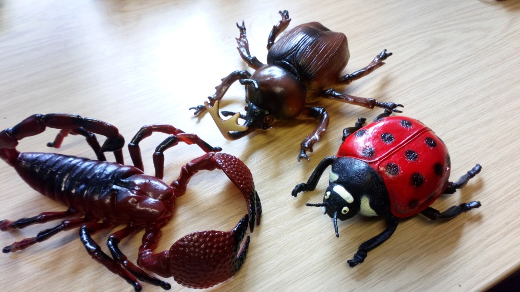 Three toy minibeasts.